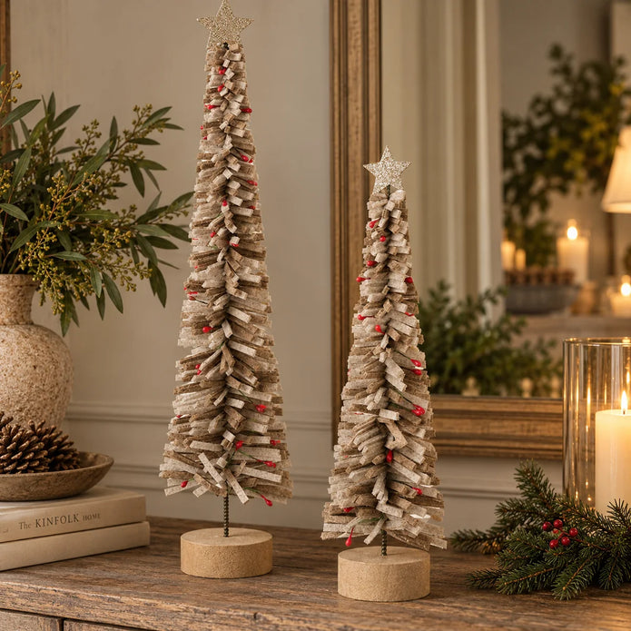 Brown felt Christmas trees medium and large styled together with star toppers on rustic Christmas sideboard