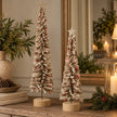 Brown felt Christmas trees medium and large styled together with star toppers on rustic Christmas sideboard