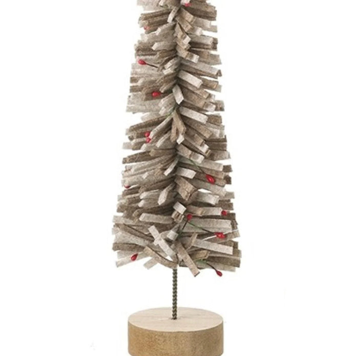 Close-up of curled brown felt strips small red berry details and wooden base of Christmas tree