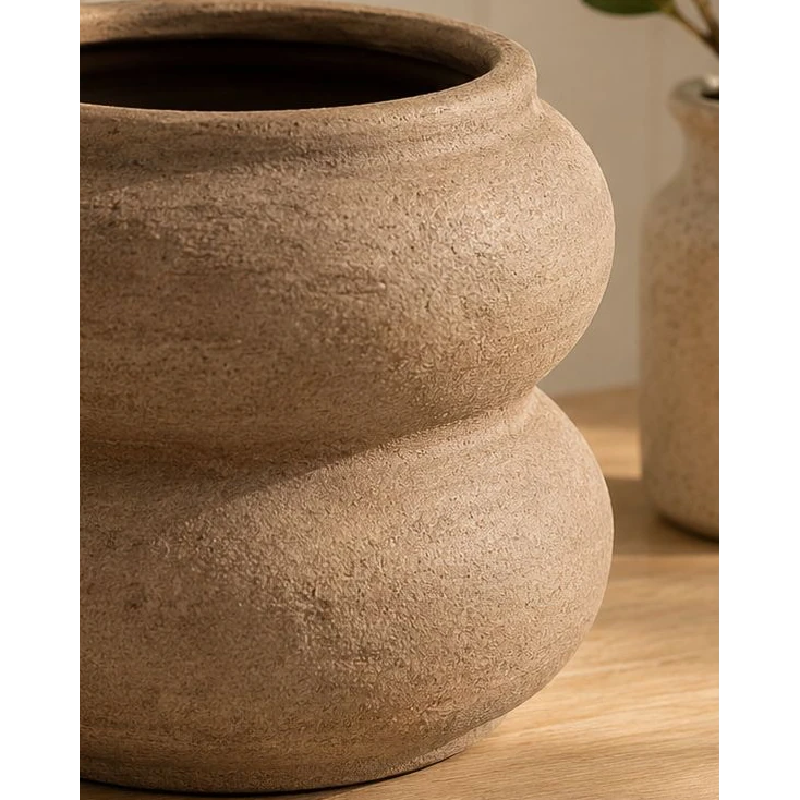 Brown Textured Sculptured Vase, close-up of the brown vase's textured curved body