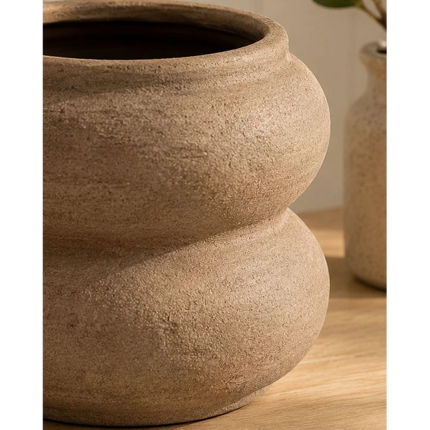 Brown Textured Sculptured Vase, close-up of the brown vase's textured curved body