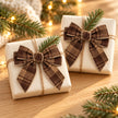 Pair of brown checked tweed bows on two wrapped Christmas gifts