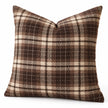 Angled studio view of brown and cream tartan cushion cover