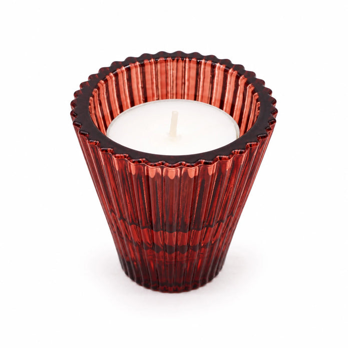 Close-up of burgundy ribbed glass holder with a white tealight