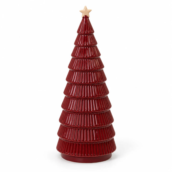 Angled studio view of burgundy ceramic Christmas tree showing ribbed tiers