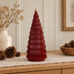 Large burgundy ceramic tree on oak sideboard with neutral Christmas decor