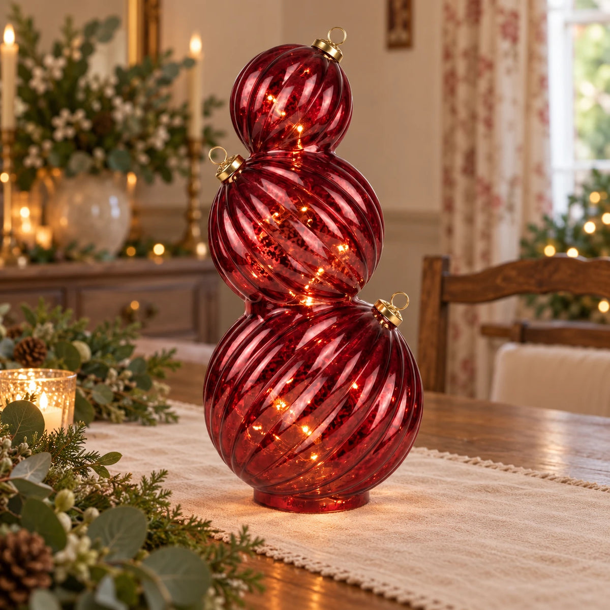 Burgundy light-up LED stacking glass Christmas baubles on a dining table, decorative holiday ornaments by Candlelight Products Ltd.