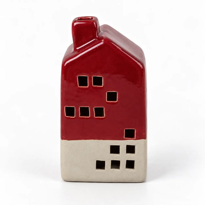 Front studio view of the burgundy ceramic glaze and square windows of the LED house.