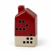 Burgundy red and cream ceramic LED house, unlit full studio view on white.