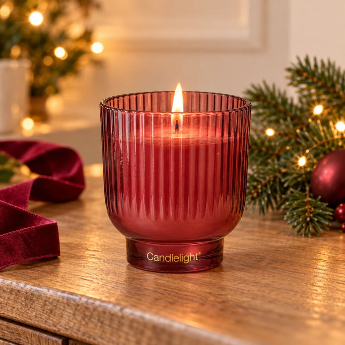 Burgundy medium ridged footed glass candle for Christmas by Candlelight Products Ltd, featuring a textured, decorative design.