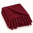 Burgundy Sherpa Tasselled Blanket Throw from Riva Home, soft and cozy with tassel accents for stylish comfort.