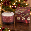 Burgundy red Christmas stockings and baubles candle by Candlelight Products Ltd, festive holiday decor with warm candlelight.