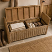 Lows Burley Rattan Rectangle Trunk Bench with woven rattan design, sturdy wooden frame, and spacious storage compartment.
