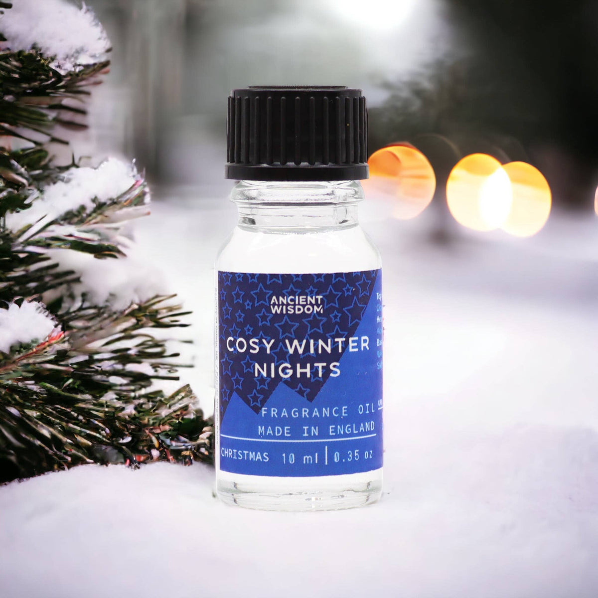 Ancient Wisdom Cosy Winter Nights Christmas fragrance oil 10ml bottle with festive holiday-themed packaging.