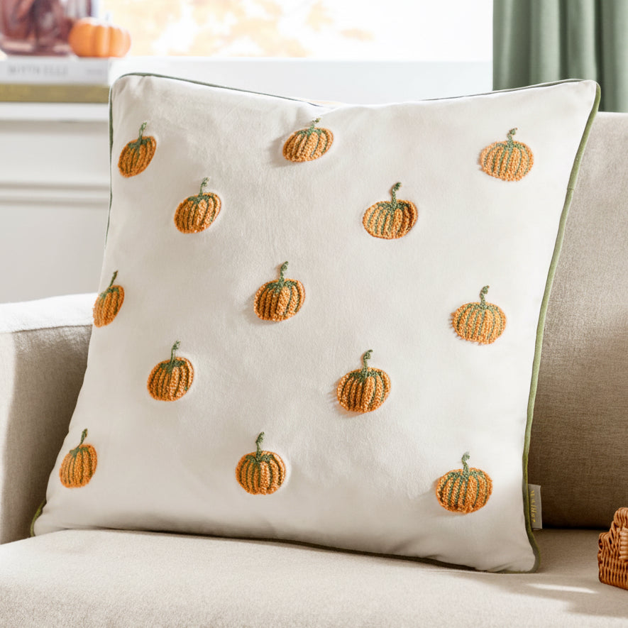 Decorative pillow with pumpkin pattern on a couch
