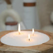White scented candle sand kit from The Candledust Nordic Lights home fragrance collection, featuring a cozy candle setup.
