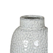 White glazed Cairn Dimple vase by Hill Interiors, showcasing a smooth, rounded ceramic design with a textured dimpled surface.