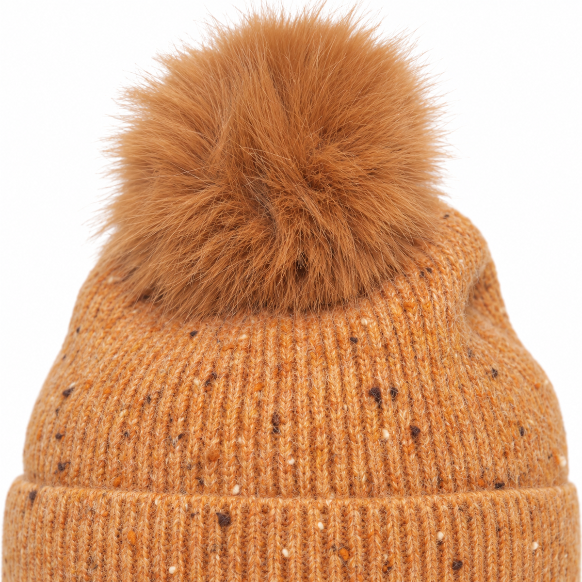 Close-up of camel speckle rib knit and faux-fur pom pom texture