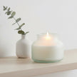 Frosted blue large sea salt scented candle from Candlelight Products Ltd, with a smooth, rounded wax surface and wavy flame.