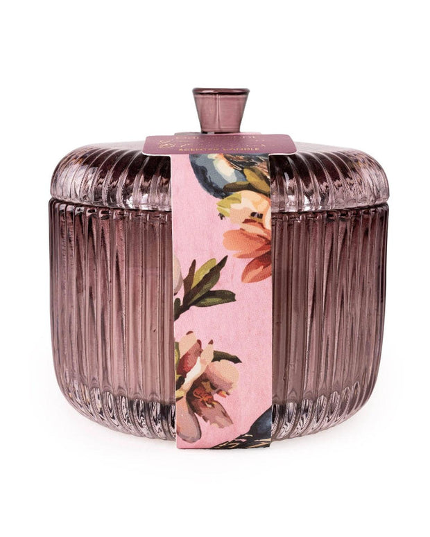 Ridged glass jar with lid containing Candle Garden Plum candle by Candlelight Products Ltd, showing the decorative candle container.