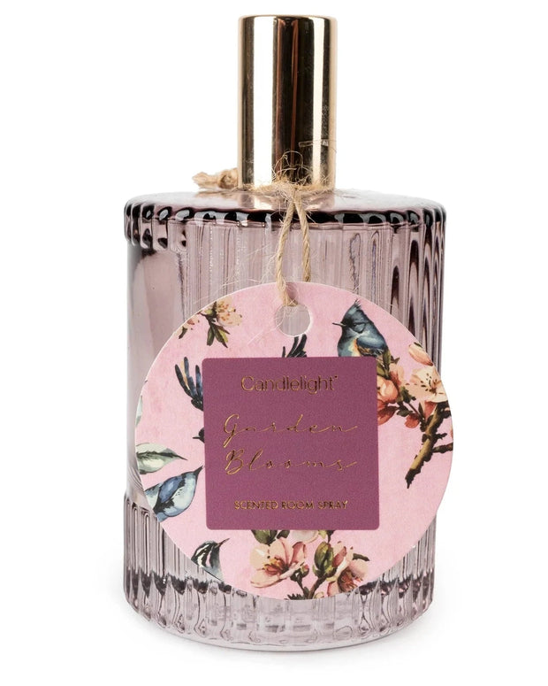 Ridged glass bottle of Candlelight Products Ltd Garden Blooms Plum room spray with a floral design and purple hues.