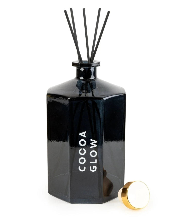 Black diffuser bottle labeled 'Cocoa Glow' on a white background