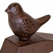 White studio close-up of the bird's feather detail and textured rust-brown cast iron finish.
