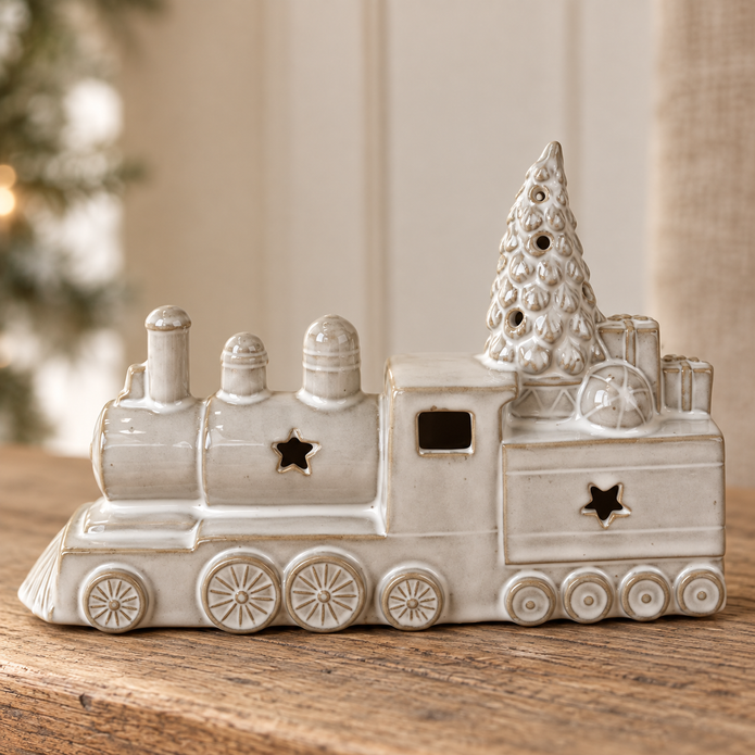 Close-up detail of the glazed ceramic Christmas train, wheels, stars and tree