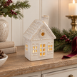 Large White LED Christmas Decorated House styled in a warm neutral Christmas interior