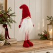 Traditional Red Standing Christmas Gonk styled in a warm neutral Christmas interior