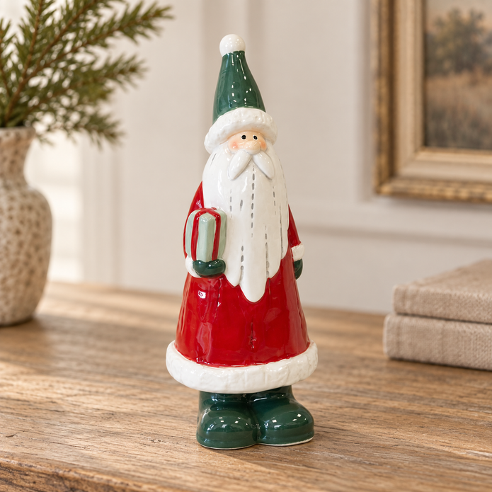 Close-up detail of Large Red Ceramic Santa Holding a Present