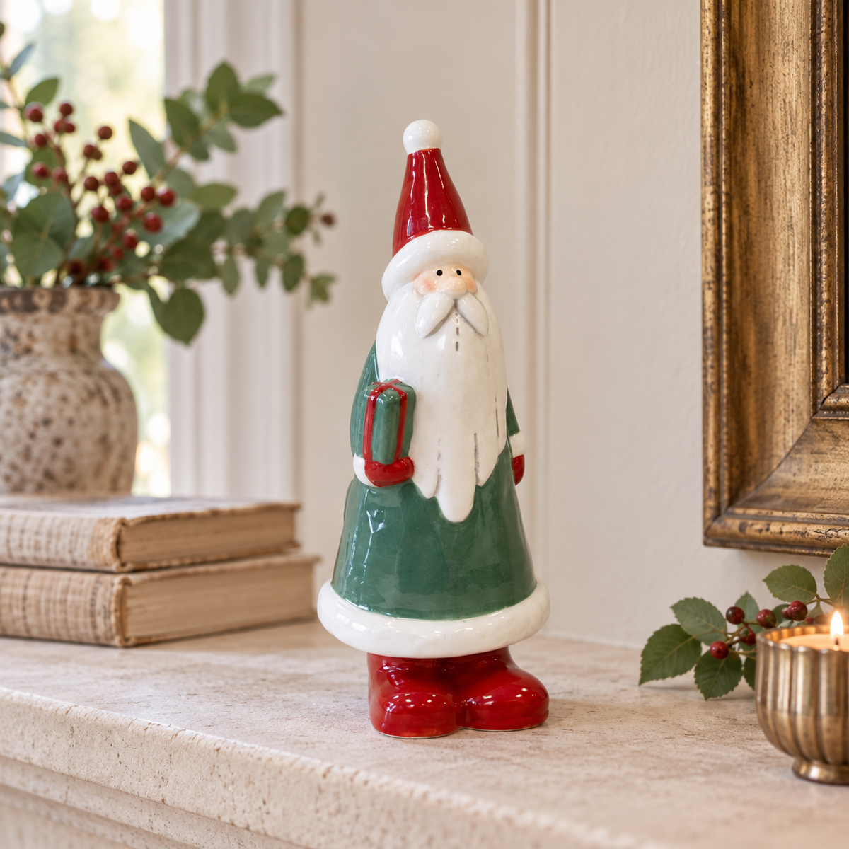 Large Green Ceramic Santa Holding a Present styled in a warm neutral Christmas interior