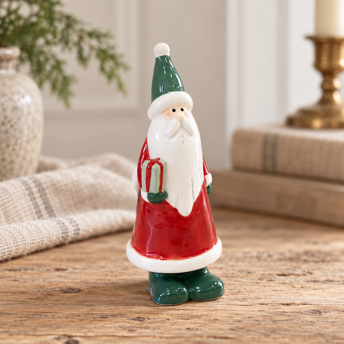 Close-up detail of Small Red Ceramic Santa Holding a Present