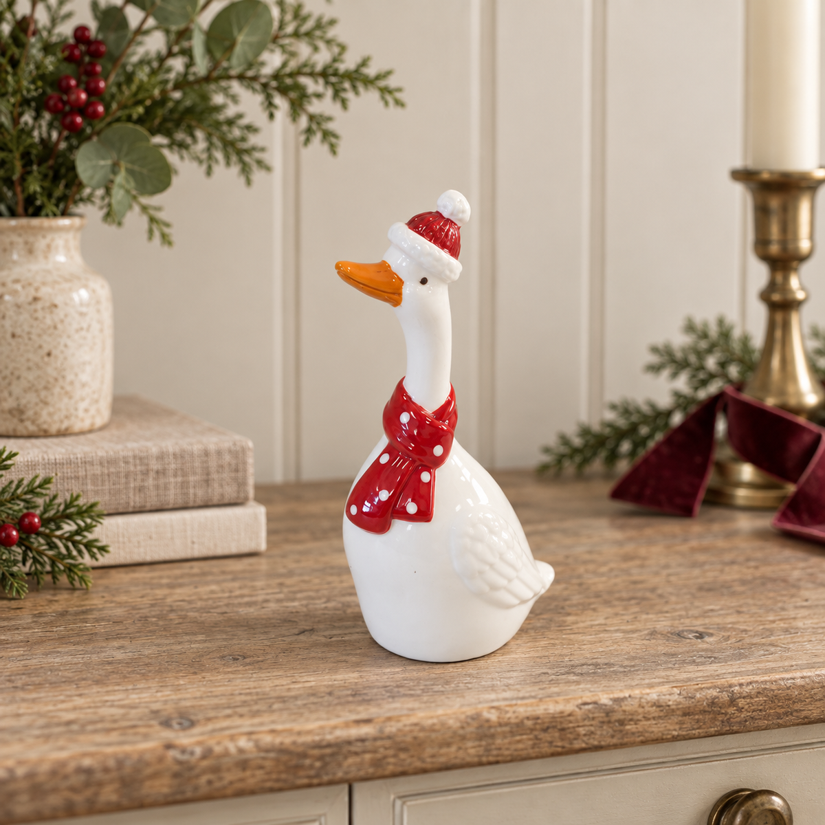Ceramic Christmas Goose With Scarf styled in a warm neutral Christmas interior