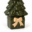 Close-up of the cream ceramic bow, green gift-shaped base and glazed tree branches.