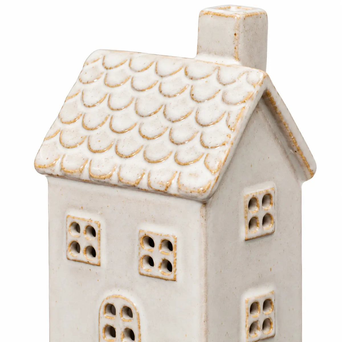 Close-up of the ceramic house's scalloped tiled roof, chimney and window cut-outs