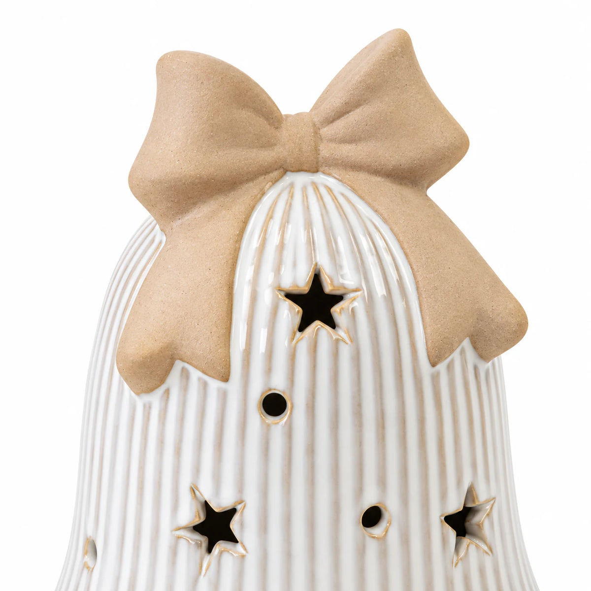 Close-up of beige ceramic bow and star cutouts on white ribbed LED Christmas bell