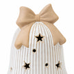 Close-up of beige ceramic bow and star cutouts on white ribbed LED Christmas bell