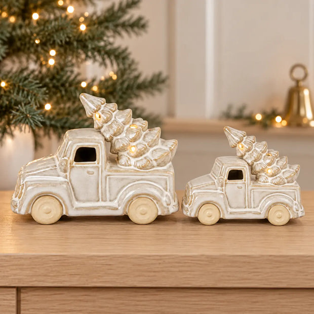 Satchville ceramic LED Christmas truck with a lit tree, displayed in two sizes, showcasing festive holiday decor and warm lighting.