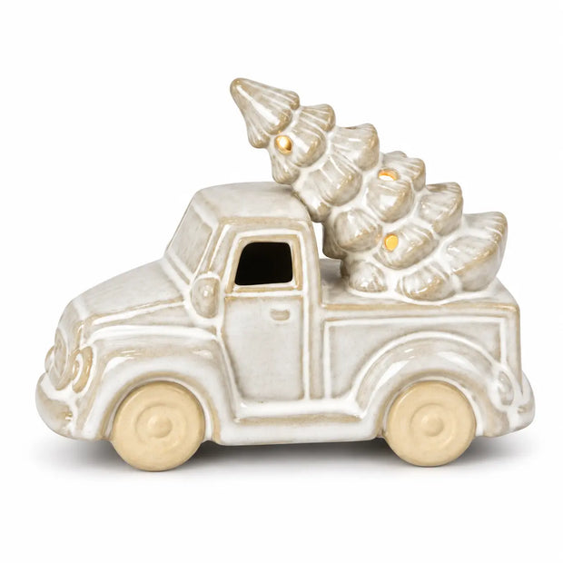 Small ceramic LED Christmas truck with tree, warm lights on, white studio background