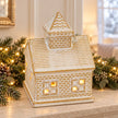 White and gold ceramic LED light up house — stone mantel