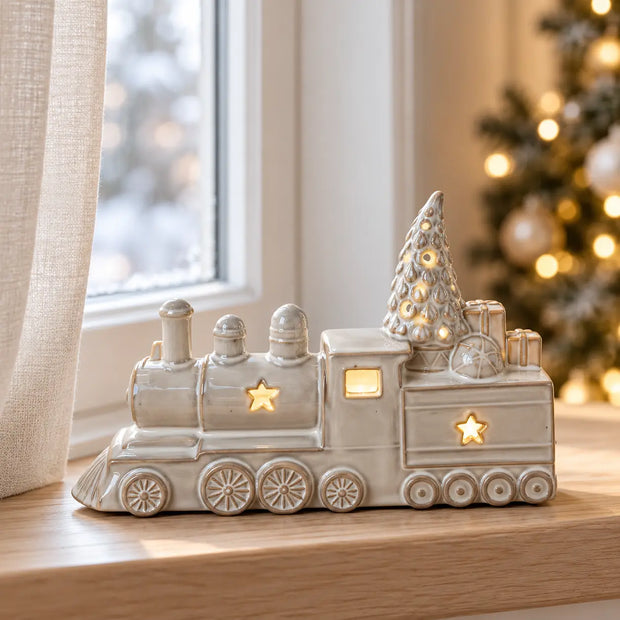 Ceramic LED light up train with tree and presents in a Christmas windowsill display