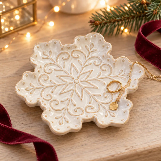 Small ceramic snowflake plate by Satchville, Christmas-themed decorative plate with intricate snowflake design for holiday decor.
