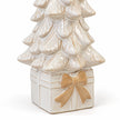 Close-up of the beige bow, gift-box base and ivory glazed branches of the ceramic Christmas tree.
