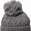 Close-up of charcoal cable knit hat and faux-fur pom pom