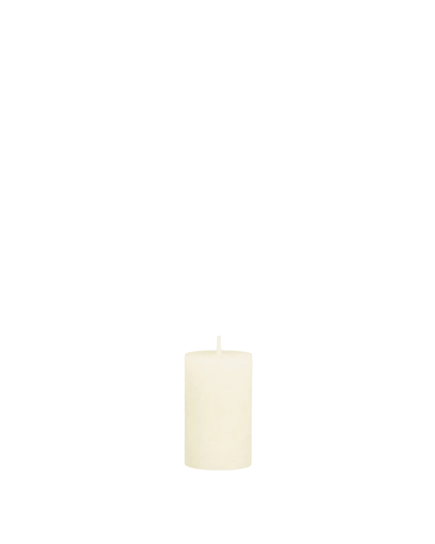 Cream rustic wax pillar candle from Chic Antique, showcasing a textured, handcrafted candle with a natural, rustic finish.