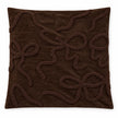 Single empty 45 x 45 cm chocolate brown bow bouclé cushion cover laid flat on white