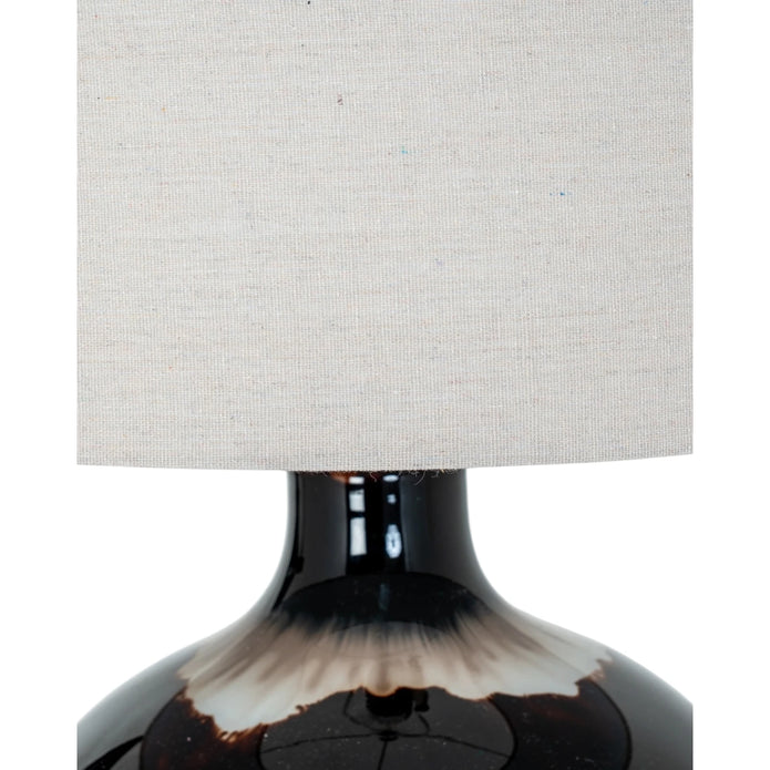 Chocolate brown glass lamp from Hill Interiors, showcasing a stylish lighting fixture with a smooth glass finish and modern design.