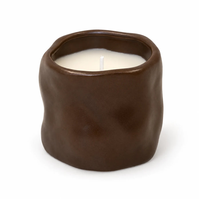 Chocolate Brown Sculpted Candle, complete and unlit on a white background