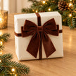 Chocolate Brown Velvet Bow - Medium on a wrapped Christmas gift